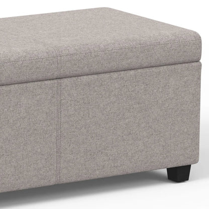 Avalon storage ottoman bench in grey textured fabric with dark legs on Tampa Home & Garden Store