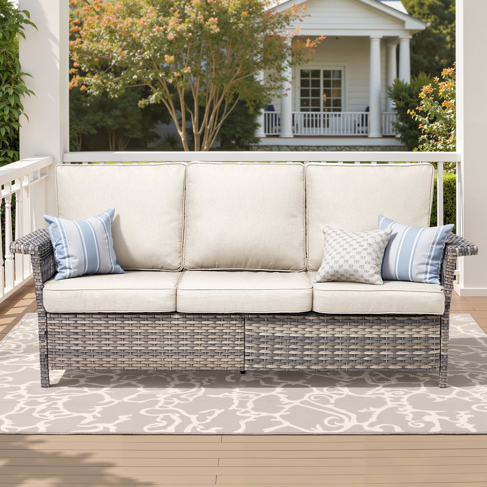 76.7-inch Wide Outdoor Wicker Patio Sofa with Armrests, beige cushions on white porch HouseOfZazla on Tampa Home & Garden Store
