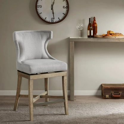 Carson counter-height stool with swivel seat, gray fabric upholstery and natural wood legs on Tampa Home & Garden Store