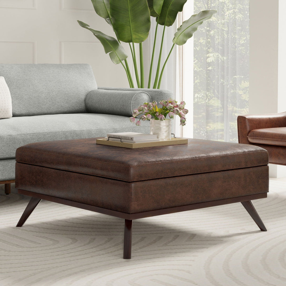 Square lift-top coffee table and storage ottoman in brown leather on Tampa Home & Garden Store