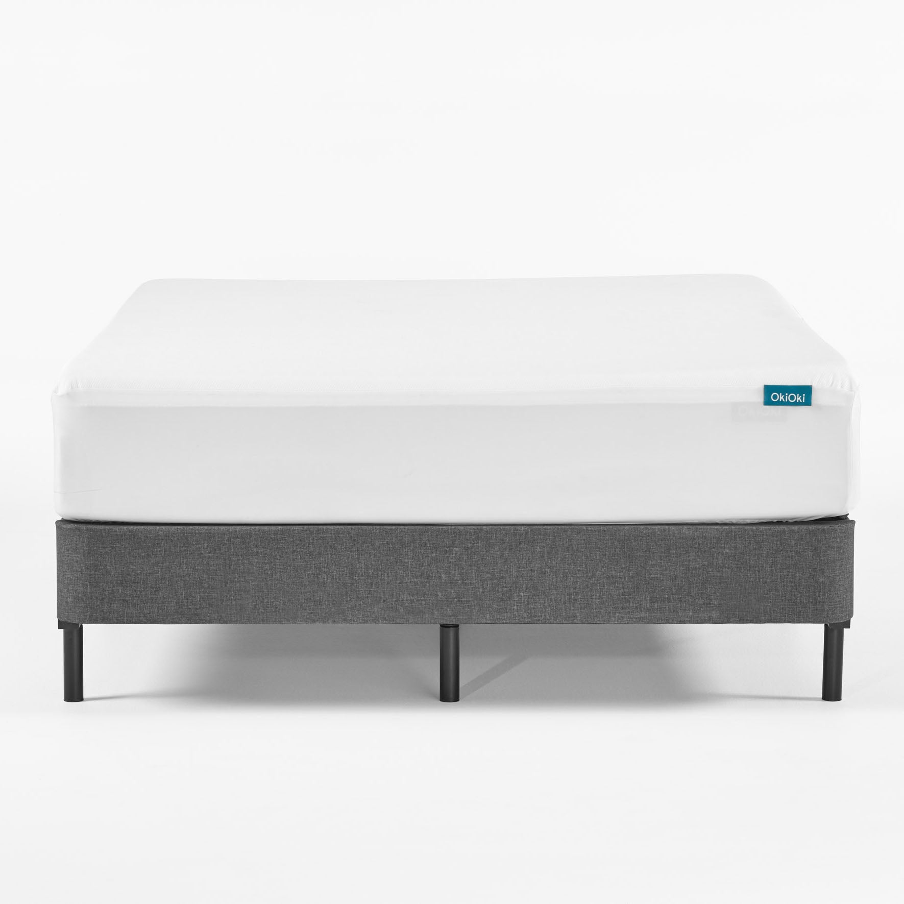 OkiOki King Mattress Protector, white top with teal label at corner on Tampa Home & Garden Store