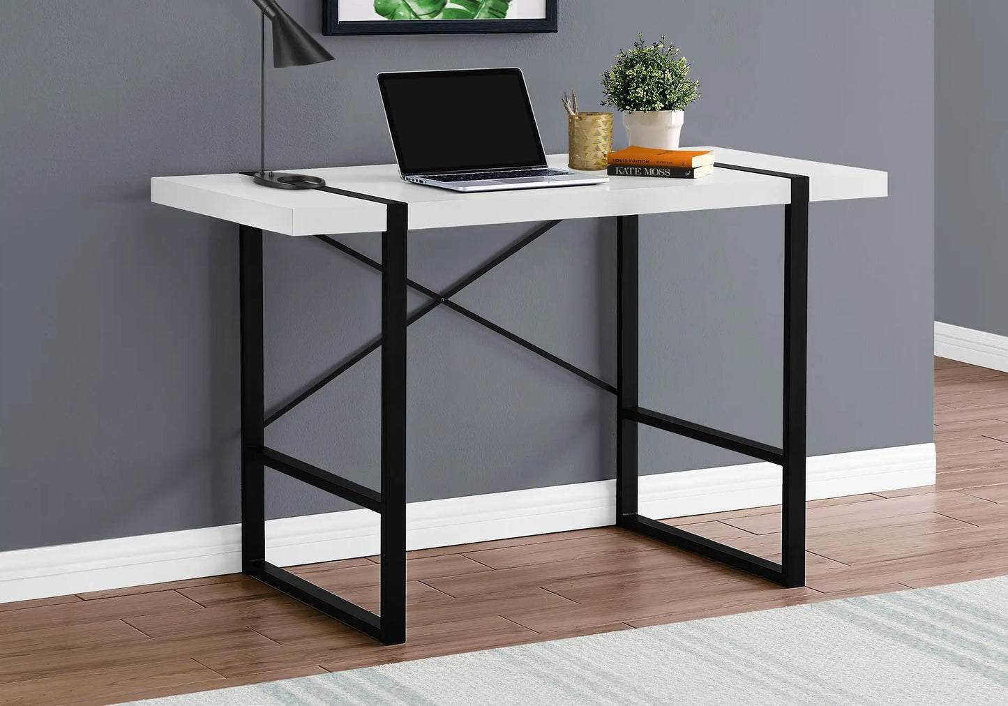 Industrial design computer desk with white top and black metal frame, laptop and plant on Tampa Home & Garden Store