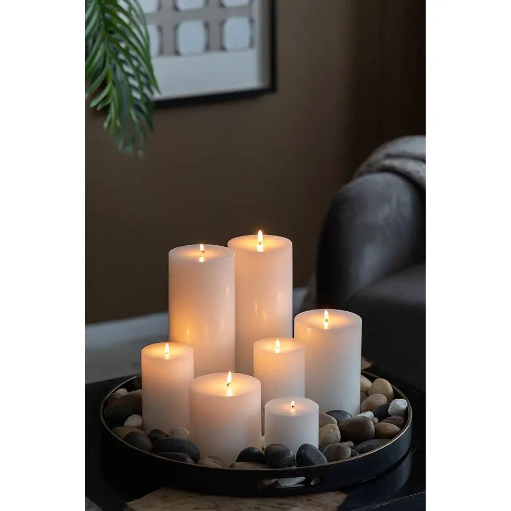 Unscented Soy Wax Pillar Candles in varying heights arranged on a round pebble tray on Tampa Home & Garden Store