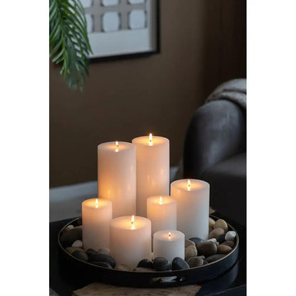 Unscented Soy Wax Pillar Candles in varying heights arranged on a round pebble tray on Tampa Home & Garden Store