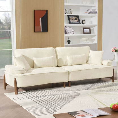 Comfortable Deep Seated Sofa with Pillows in cream fabric and wooden legs in a living room on Tampa Home & Garden Store