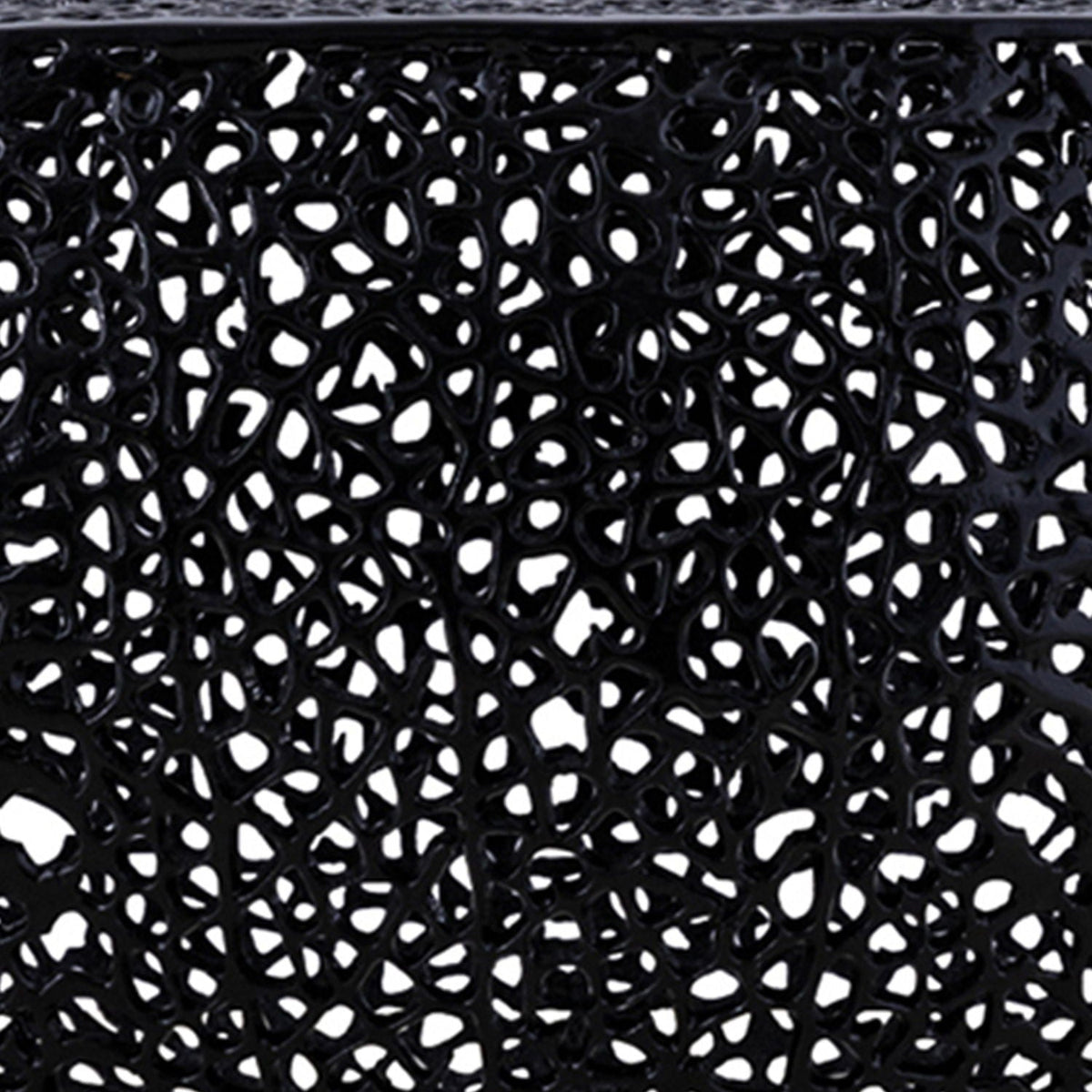 Round coffee table with black openwork lattice surface on Tampa Home & Garden Store