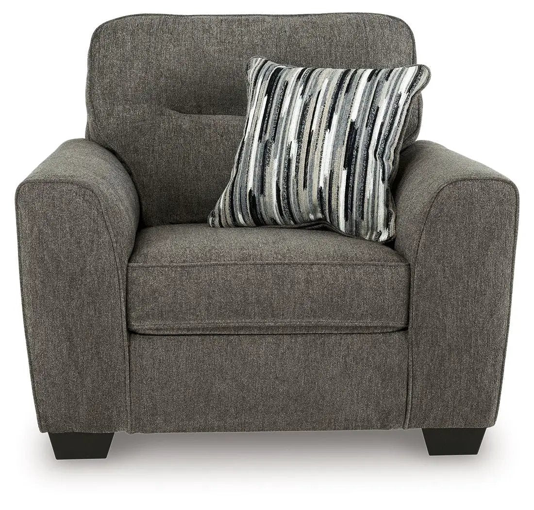 Olten stationary chair in textured gray-brown fabric with a striped decorative pillow on Tampa Home & Garden Store