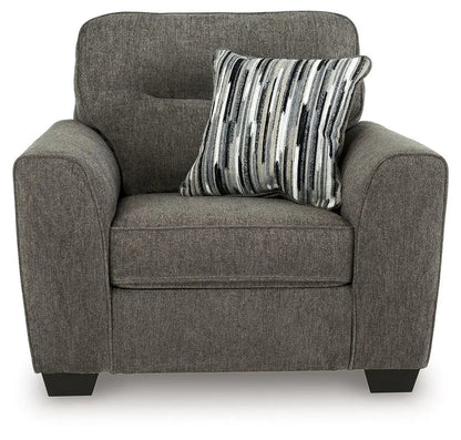 Olten stationary chair in textured gray-brown fabric with a striped decorative pillow on Tampa Home & Garden Store