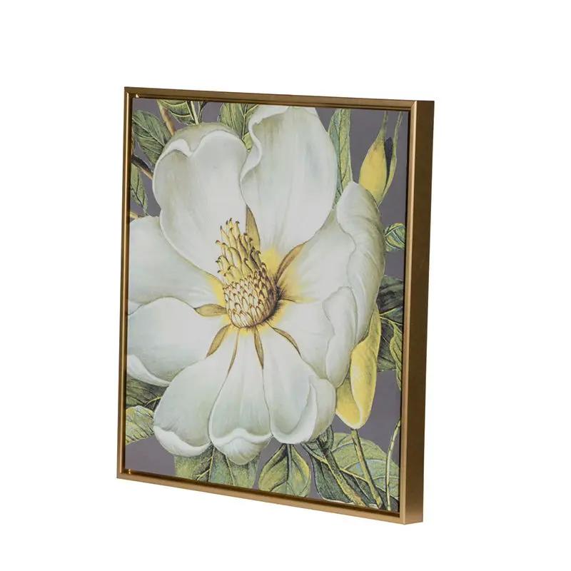 Framed botanical wall art print featuring a white magnolia on gray with a gold frame on Tampa Home & Garden Store