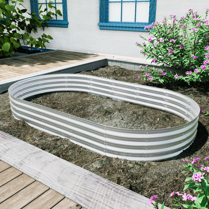 Heavy duty galvanized raised garden bed kit circular metal rings on soil beside a wooden deck on Tampa Home & Garden Store