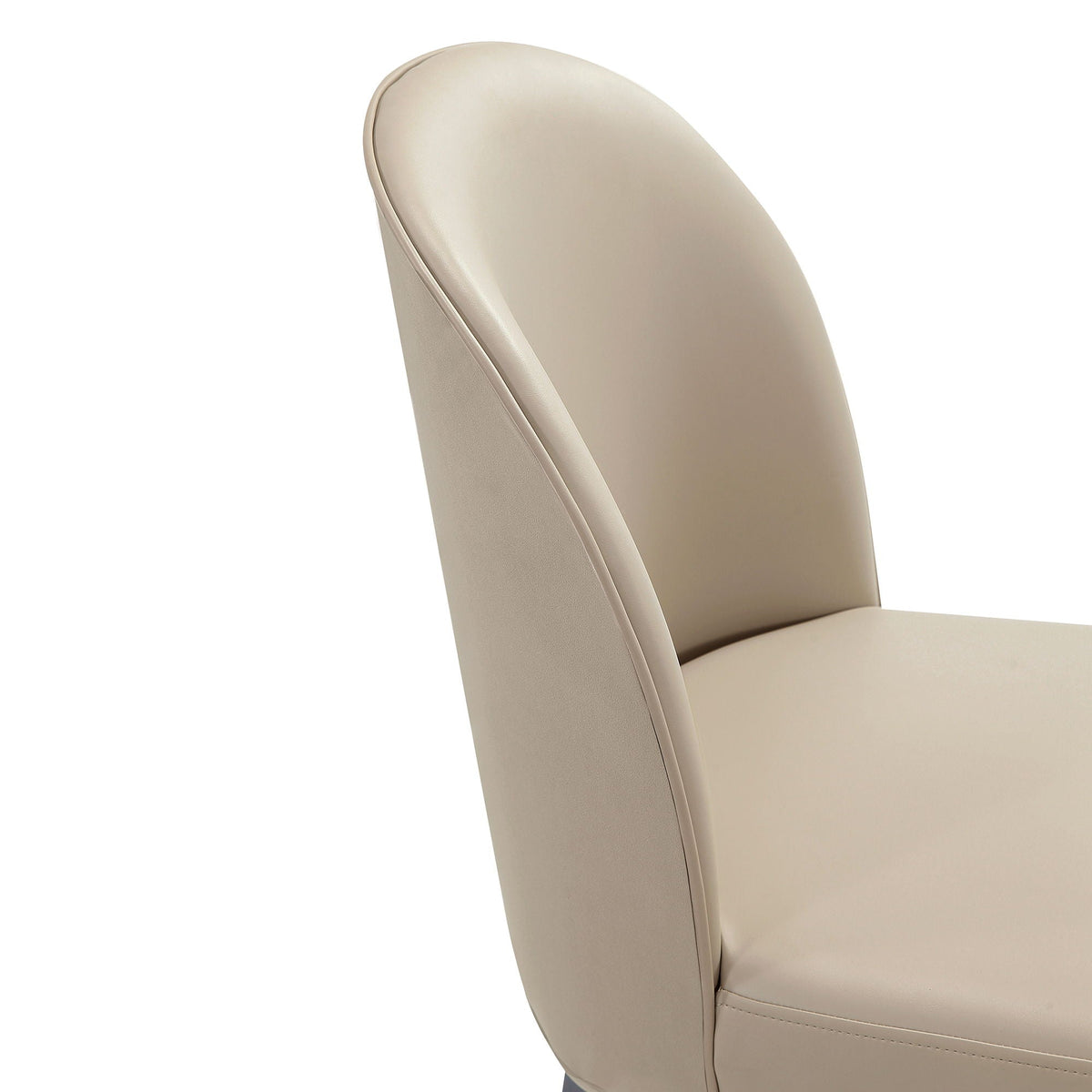 Beige faux-leather dining chair close-up with curved back and visible seam, HouseOfZazla on Tampa Home & Garden Store