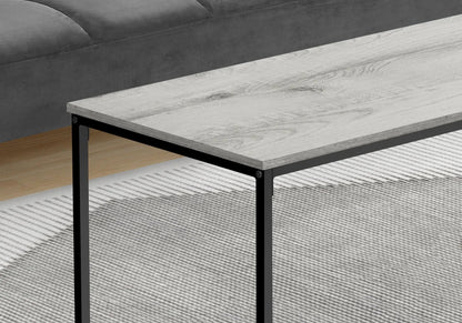 Rectangular coffee table with light gray weathered wood top and black metal frame, modern design on Tampa Home & Garden Store