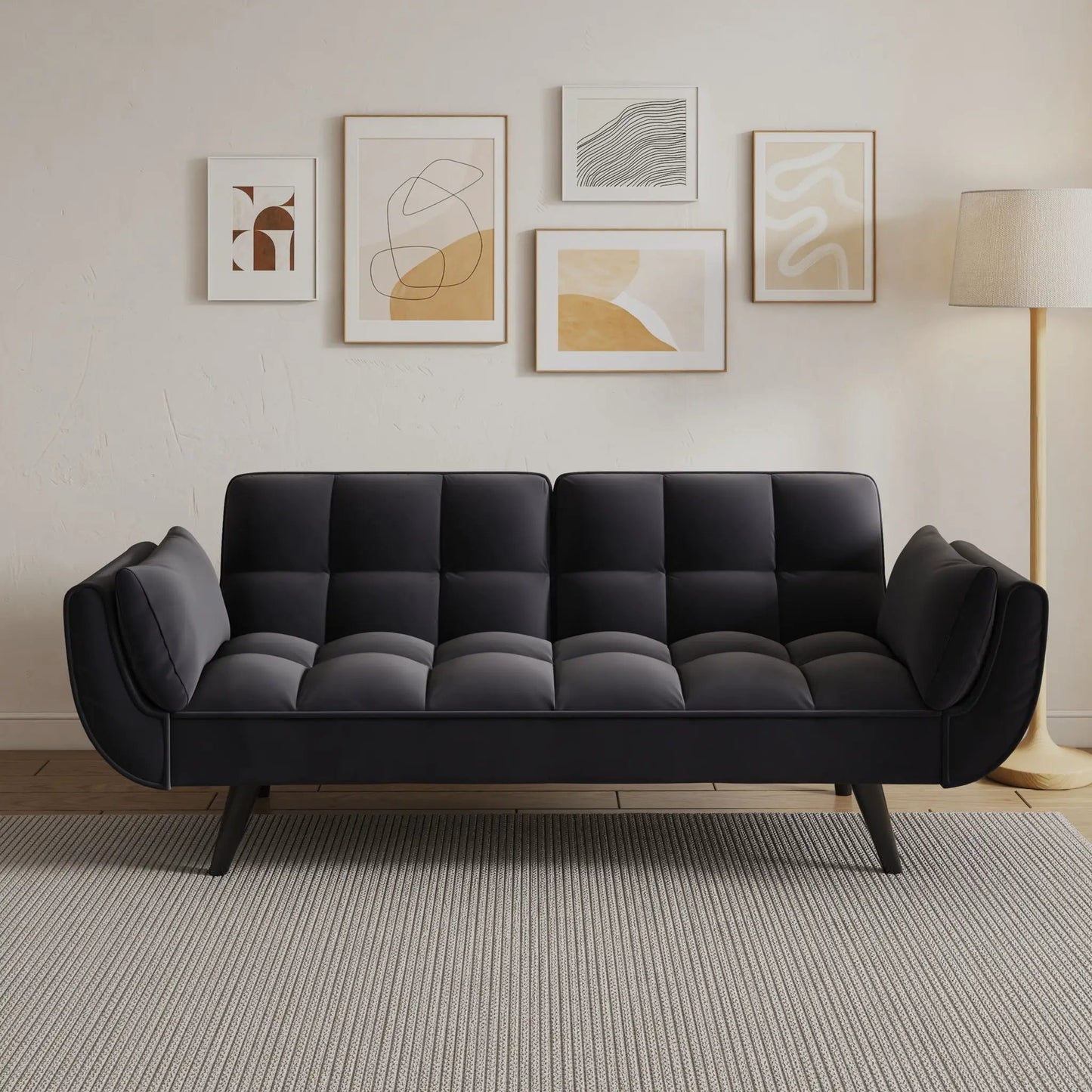 Futon sofa with black tufted cushions and two armrests, gray pillows, ideal for small apartments on Tampa Home & Garden Store