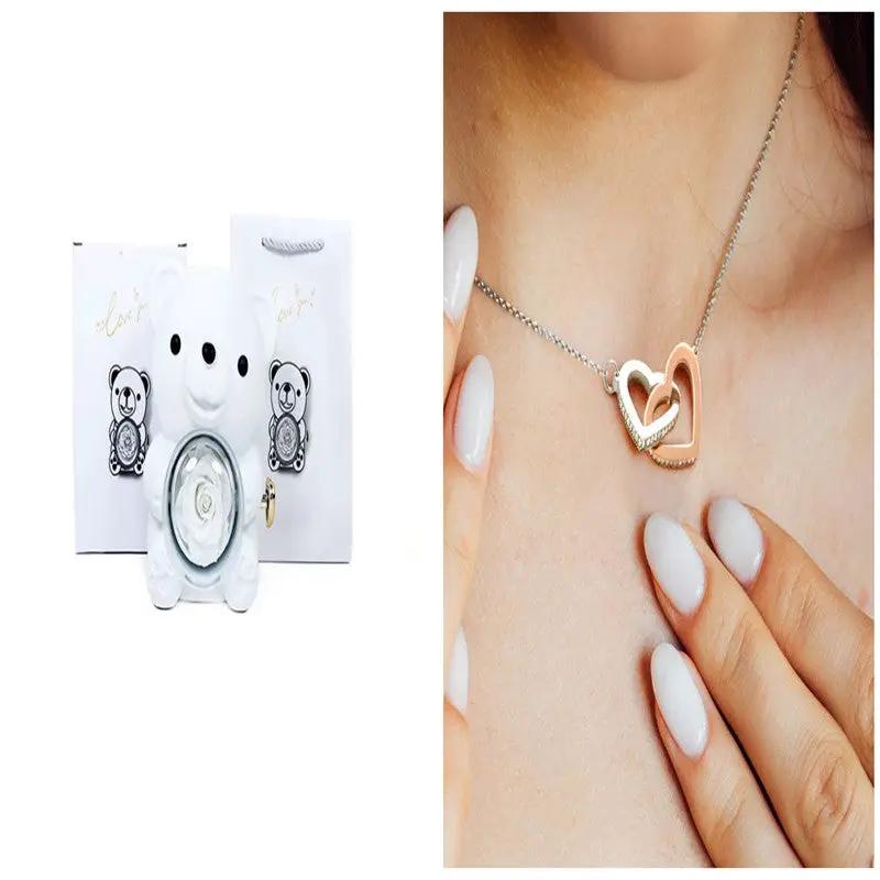 Eternal rose teddy bear gift box with necklace; two-tone heart pendant worn by model on Tampa Home & Garden Store