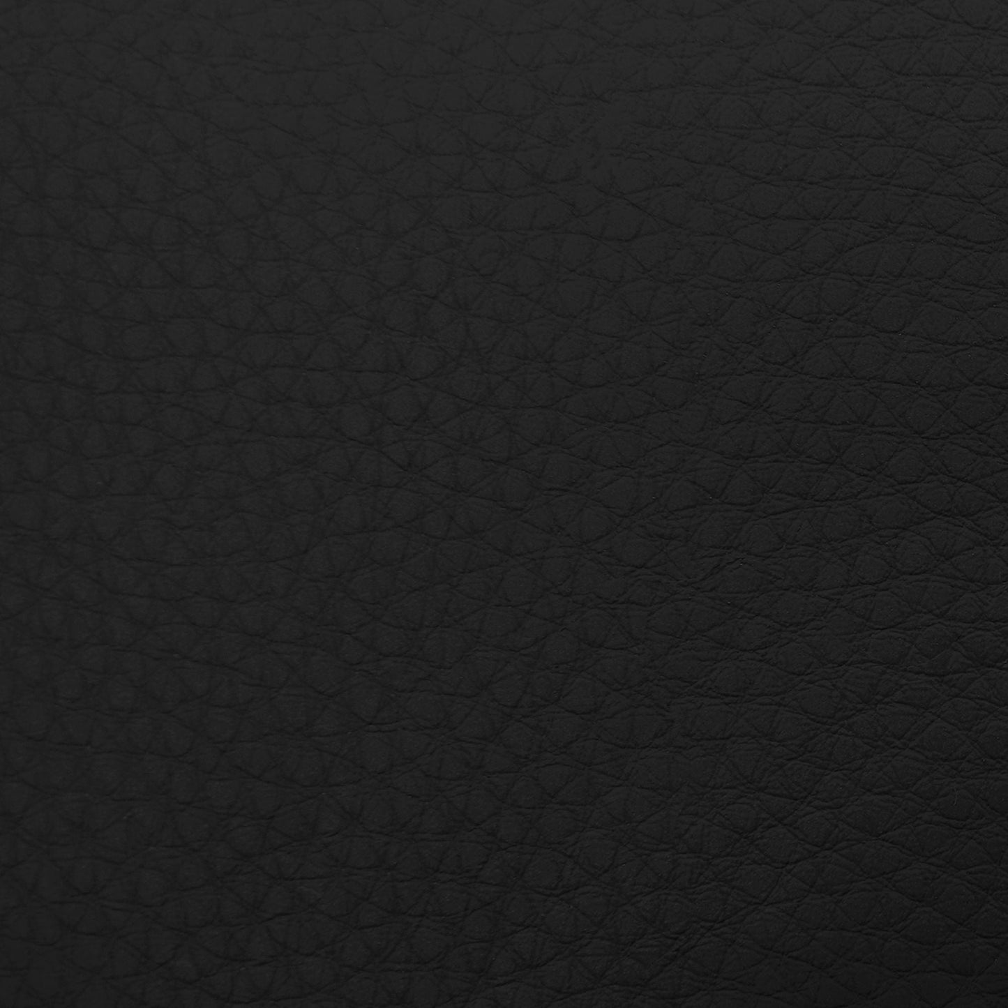 Massage chairs black textured leather upholstery close-up with grain pattern on Tampa Home & Garden Store