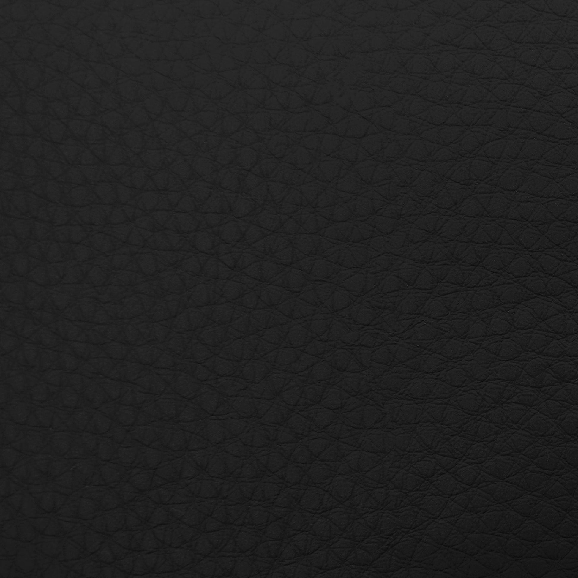Massage chairs black textured leather upholstery close-up with grain pattern on Tampa Home & Garden Store