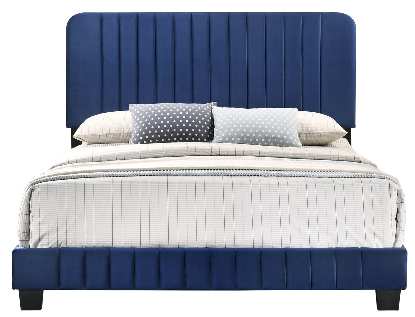 Channel tufted blue upholstered bed with striped bedding and polka dot pillows on Tampa Home & Garden Store
