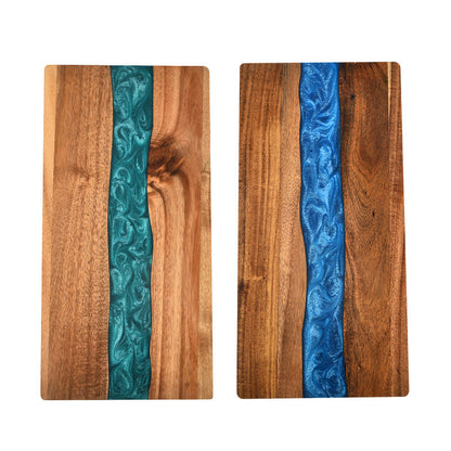 Set of 2 acacia wood cutting boards with teal and blue epoxy resin ocean wave inlays on Tampa Home & Garden Store