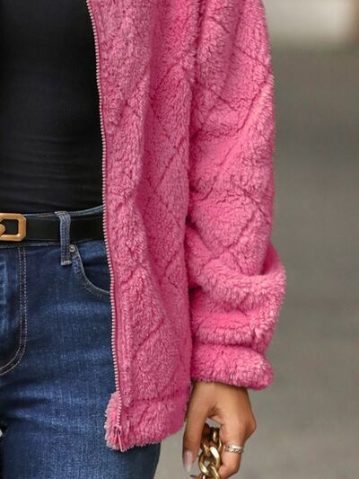 Women's fuzzy zip-up jacket in pink with plush texture on Tampa Home & Garden Store