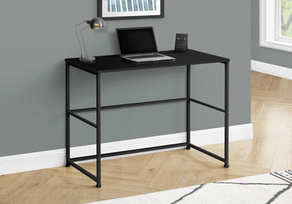 Computer desk by Unique Piece Furniture with black metal frame and smooth top, laptop and lamp on Tampa Home & Garden Store