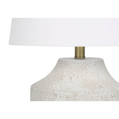 Modern concrete table lamp with cream fabric shade and brass stem on Tampa Home & Garden Store