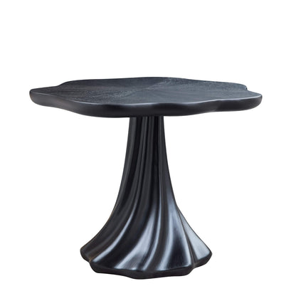 Sculptural round black dining table with petal-edge top and textured root pedestal base on Tampa Home & Garden Store