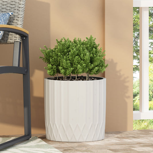 MGO Planter by HouseOfZazla, white ribbed ceramic with lush green shrubs on Tampa Home & Garden Store