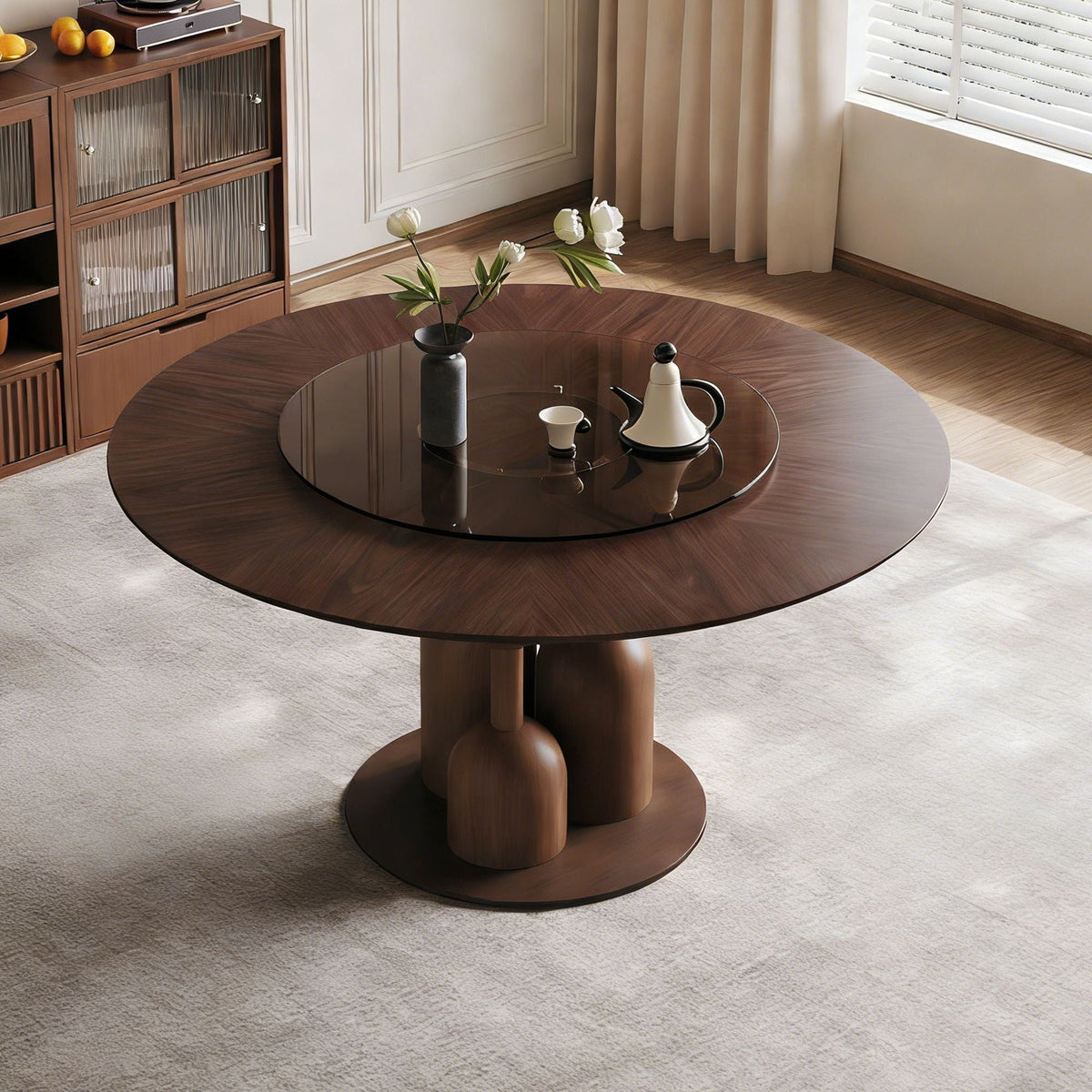 Round walnut dining table with glass lazy Susan and solid oak base in a modern living room on Tampa Home & Garden Store
