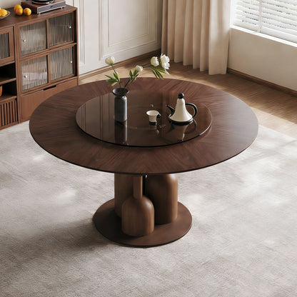 Round walnut dining table with glass lazy Susan and solid oak base in a modern living room on Tampa Home & Garden Store
