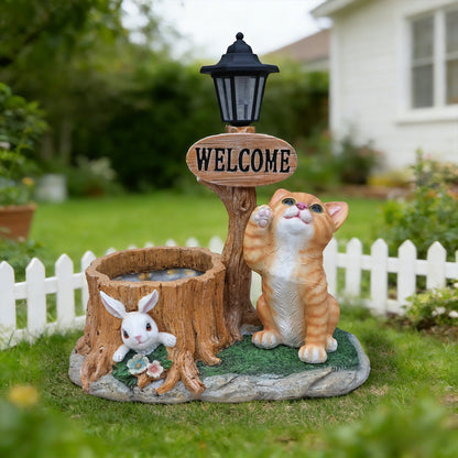 Cat planter statue and bunny garden statues beside a rustic stump with welcome sign and lantern on Tampa Home & Garden Store