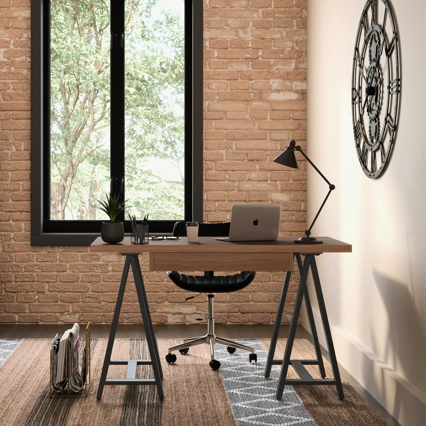 Sawhorse handcrafted solid writing desk with wood top and black metal legs in a brick office on Tampa Home & Garden Store
