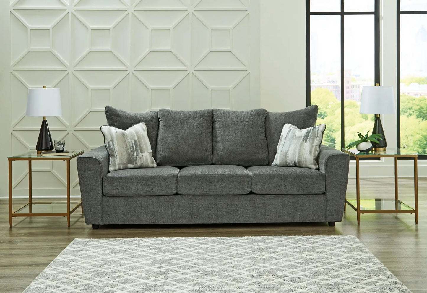 Stairatt Sofa gray stationary sofa by Unique Piece Furniture with two decorative pillows on Tampa Home & Garden Store