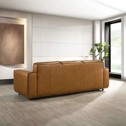 Hanky sofa brown tan leather stationary sofa with vertical seam panels in a modern living room on Tampa Home & Garden Store