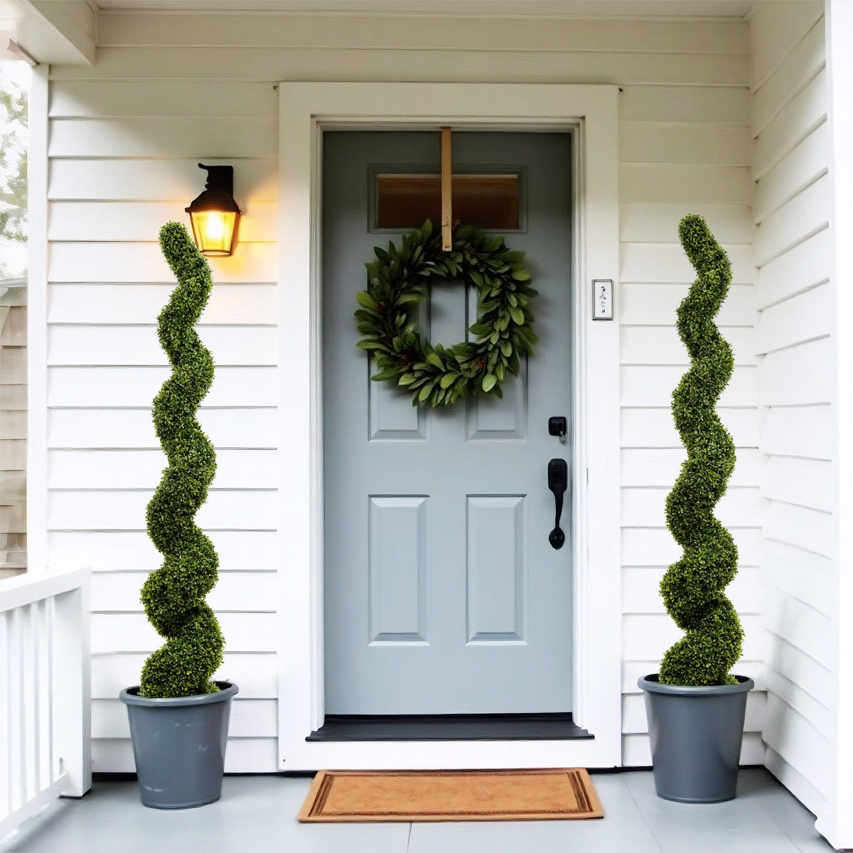 Artificial UV-resistant Boxwood Topiary Spiral Tree - Green in gray pots, spirals flanking entry on Tampa Home & Garden Store