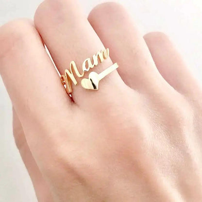 Gold-tone customized name ring with cursive lettering and heart charm, two rings on finger on Tampa Home & Garden Store