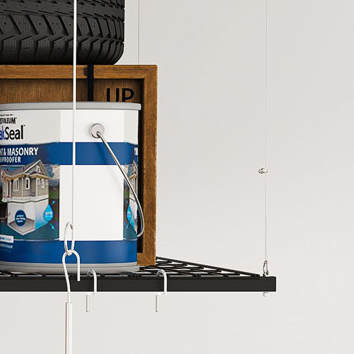Overhead garage storage rack with crank system in black by HouseOfZazla mounted on wall on Tampa Home & Garden Store