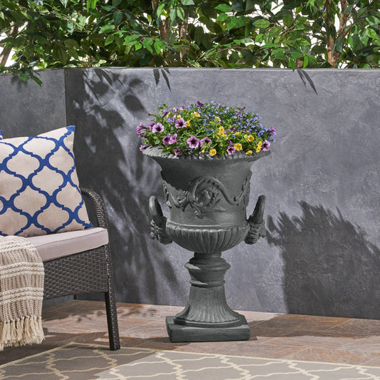 MGO Garden Urn Planter gray stone finish filled with purple, yellow, and blue flowers on Tampa Home & Garden Store