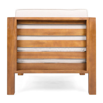 Outdoor club chair with warm brown wood frame and beige cushions on Tampa Home & Garden Store