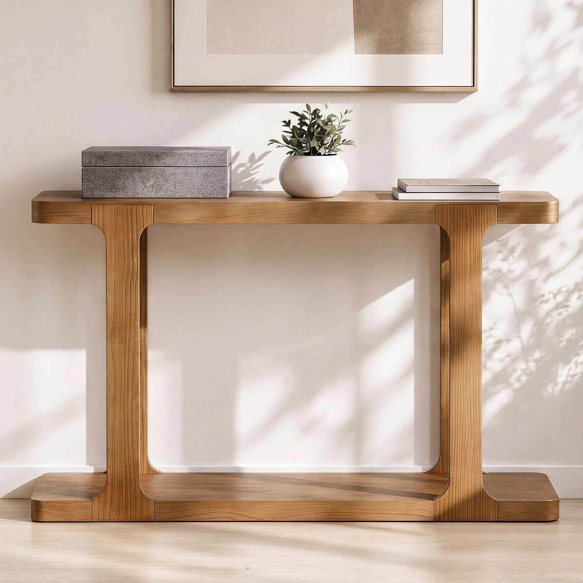 Walnut console table with bottom shelf; gray boxes, white planter with greenery, books on Tampa Home & Garden Store