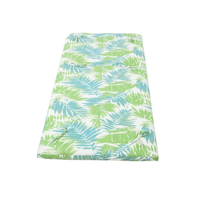 Outdoor lounge chaise cushion with green and blue tropical leaf print on white background on Tampa Home & Garden Store