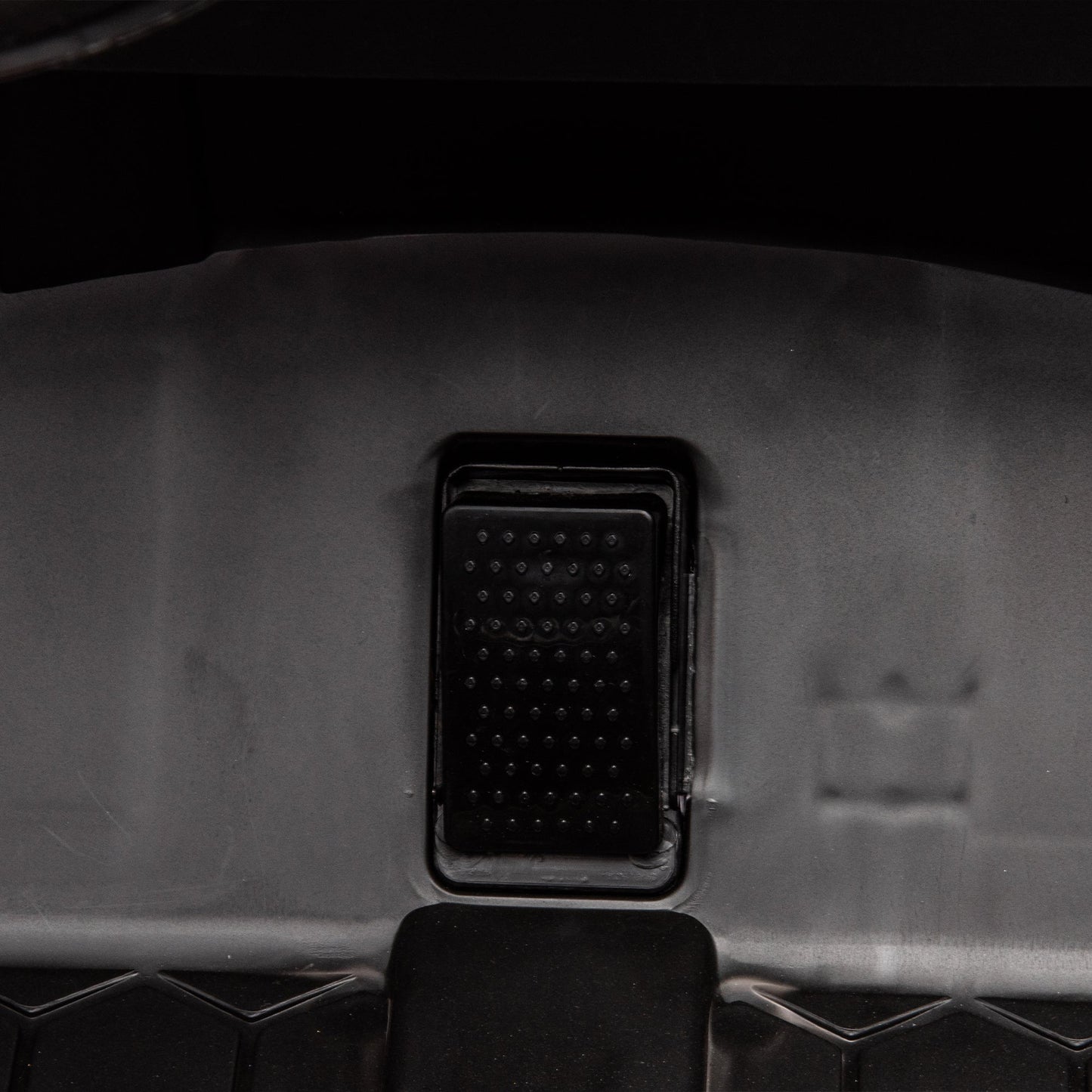Side by side 4x4 ride-on off-road truck interior view with black textured pedal panel on Tampa Home & Garden Store