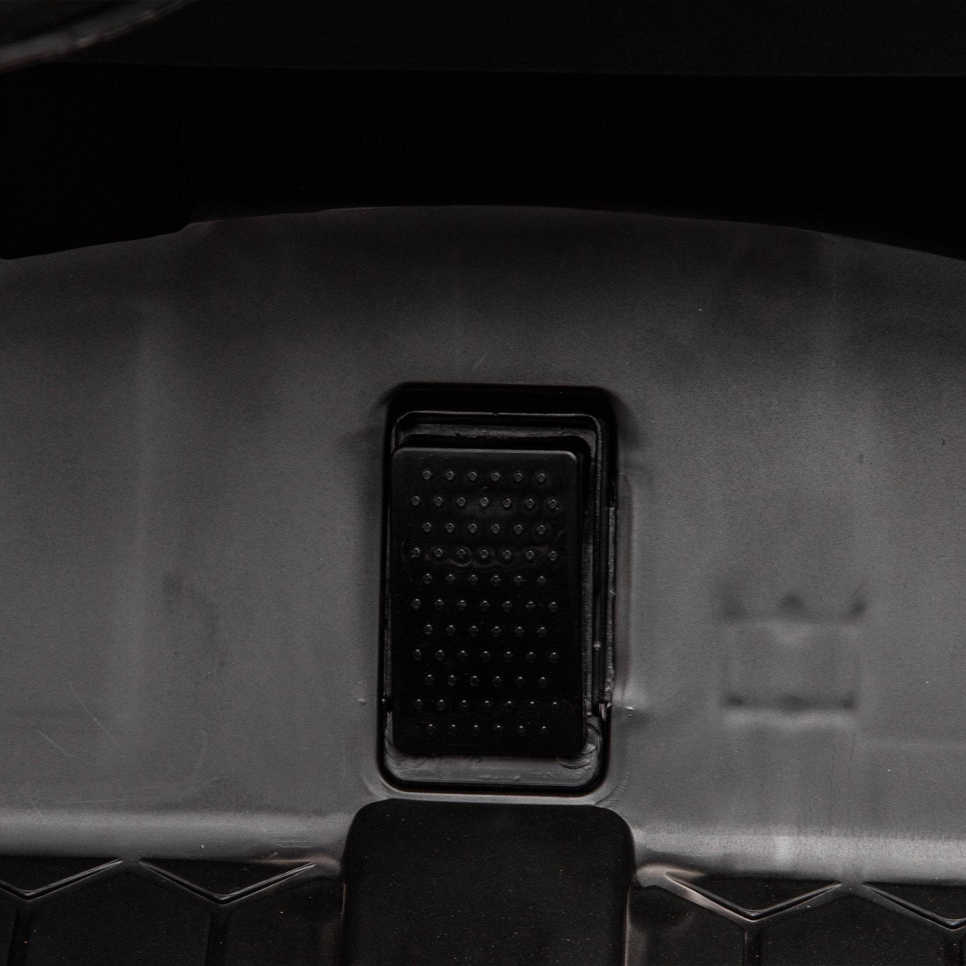 Side by side 4x4 ride-on off-road truck interior view with black textured pedal panel on Tampa Home & Garden Store
