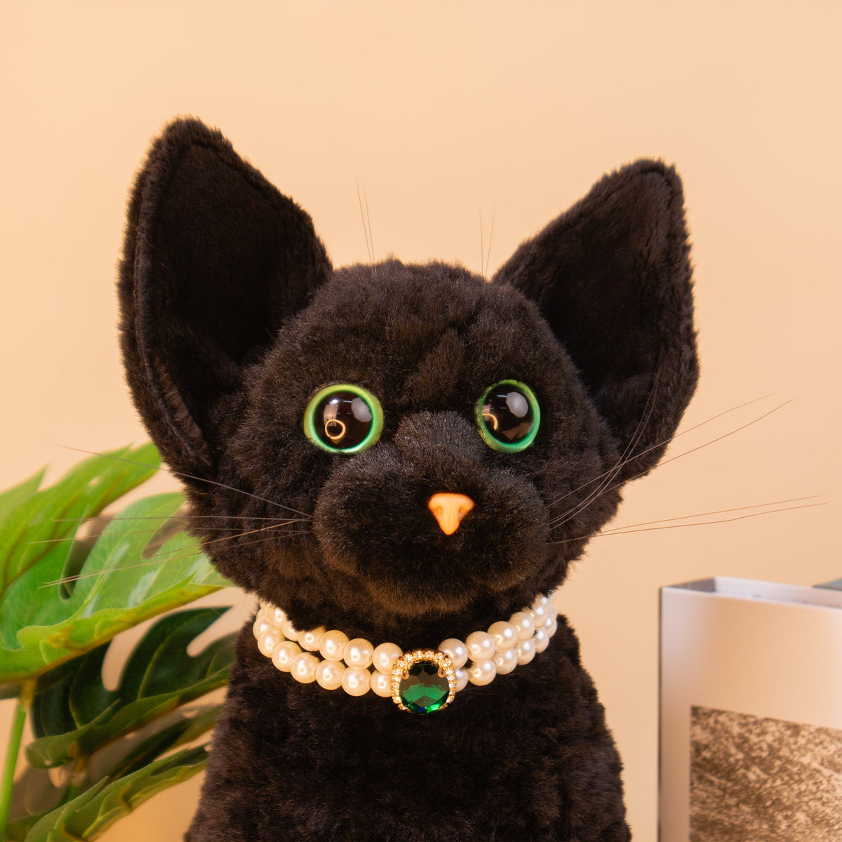 Devon Rex Cat Plush by Chongker, black plush with green eyes and pearl necklace on Tampa Home & Garden Store