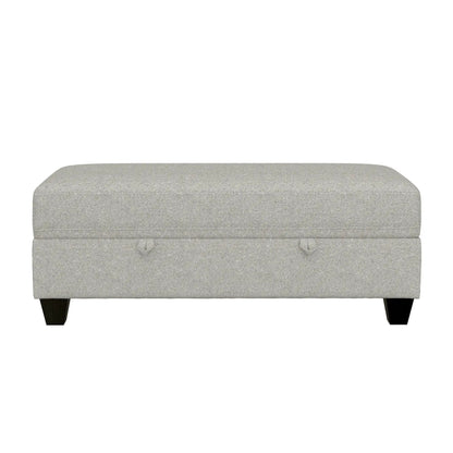 Drason storage ottoman in light gray textured fabric with rounded edges and dark legs on Tampa Home & Garden Store