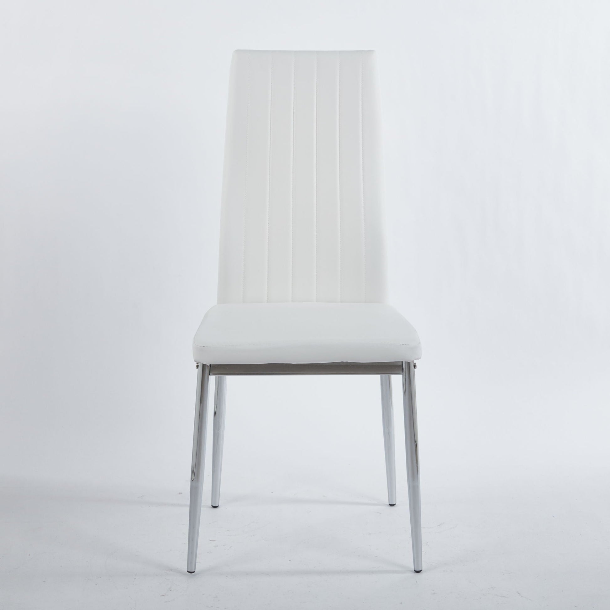 Minimalist white dining chair with chrome legs and vertical back stitching on Tampa Home & Garden Store
