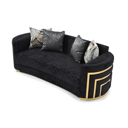 Soledad sofa in black tufted fabric with gold curved trim and decorative pillows on Tampa Home & Garden Store