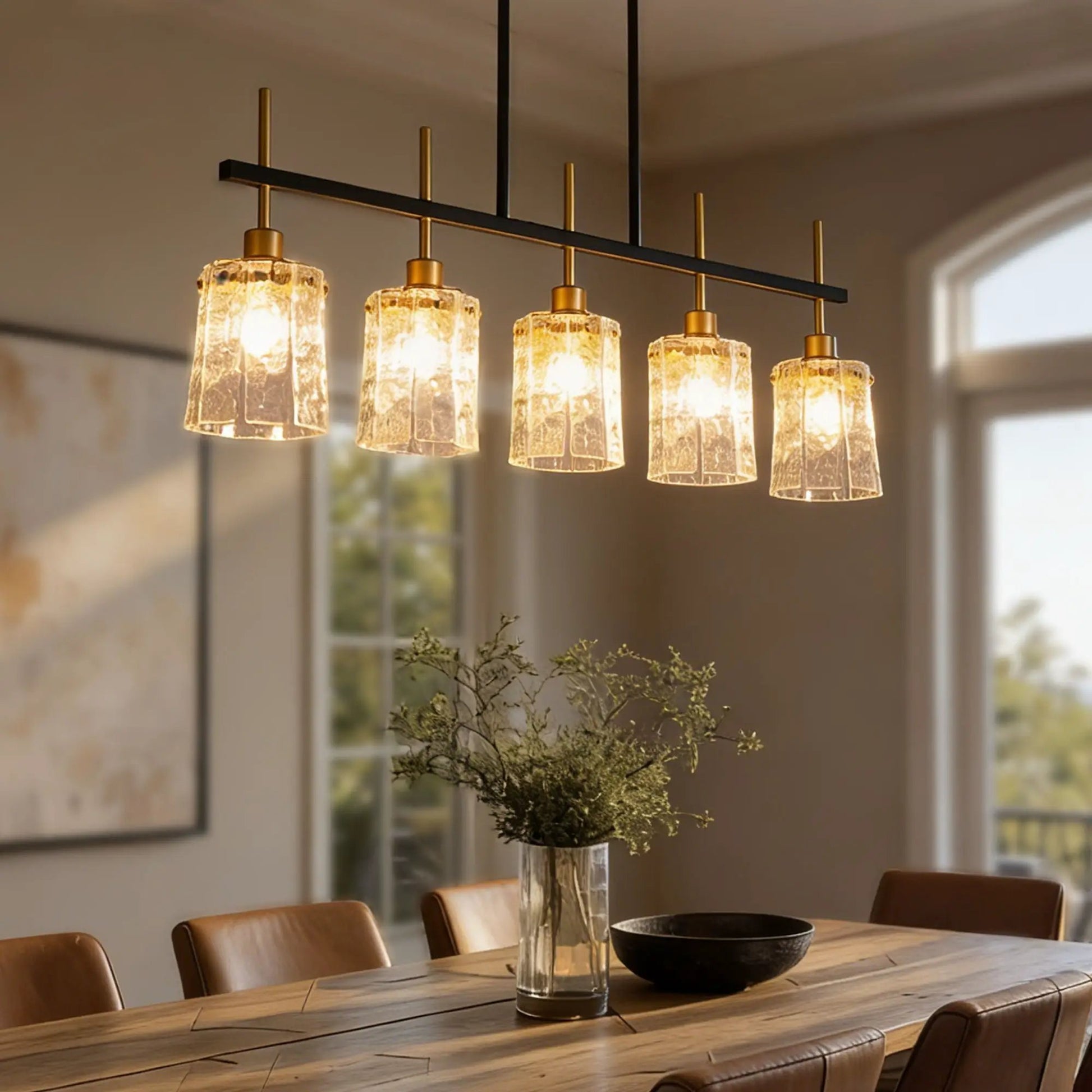 Chandelier 5-Light linear fixture in black and gold with textured glass shades over dining table on Tampa Home & Garden Store