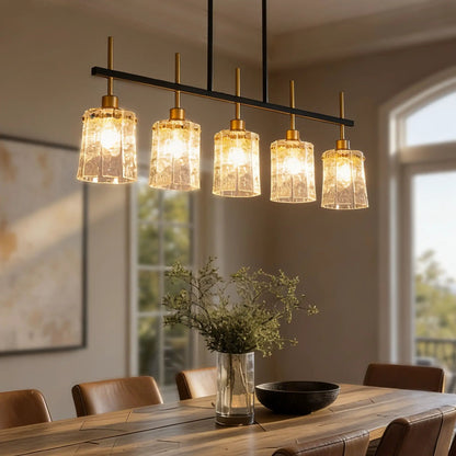 Chandelier 5-Light linear fixture in black and gold with textured glass shades over dining table on Tampa Home & Garden Store