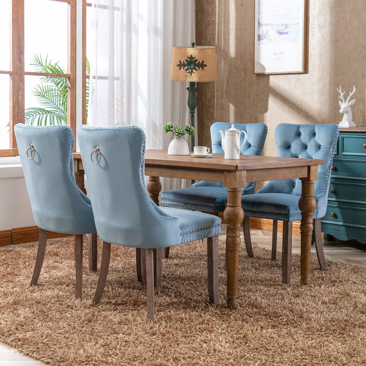 Set of 4 blue tufted velvet dining chairs with nailhead trim by HouseOfZazla on Tampa Home & Garden Store