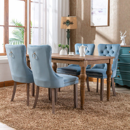 Set of 4 blue tufted velvet dining chairs with nailhead trim by HouseOfZazla on Tampa Home & Garden Store